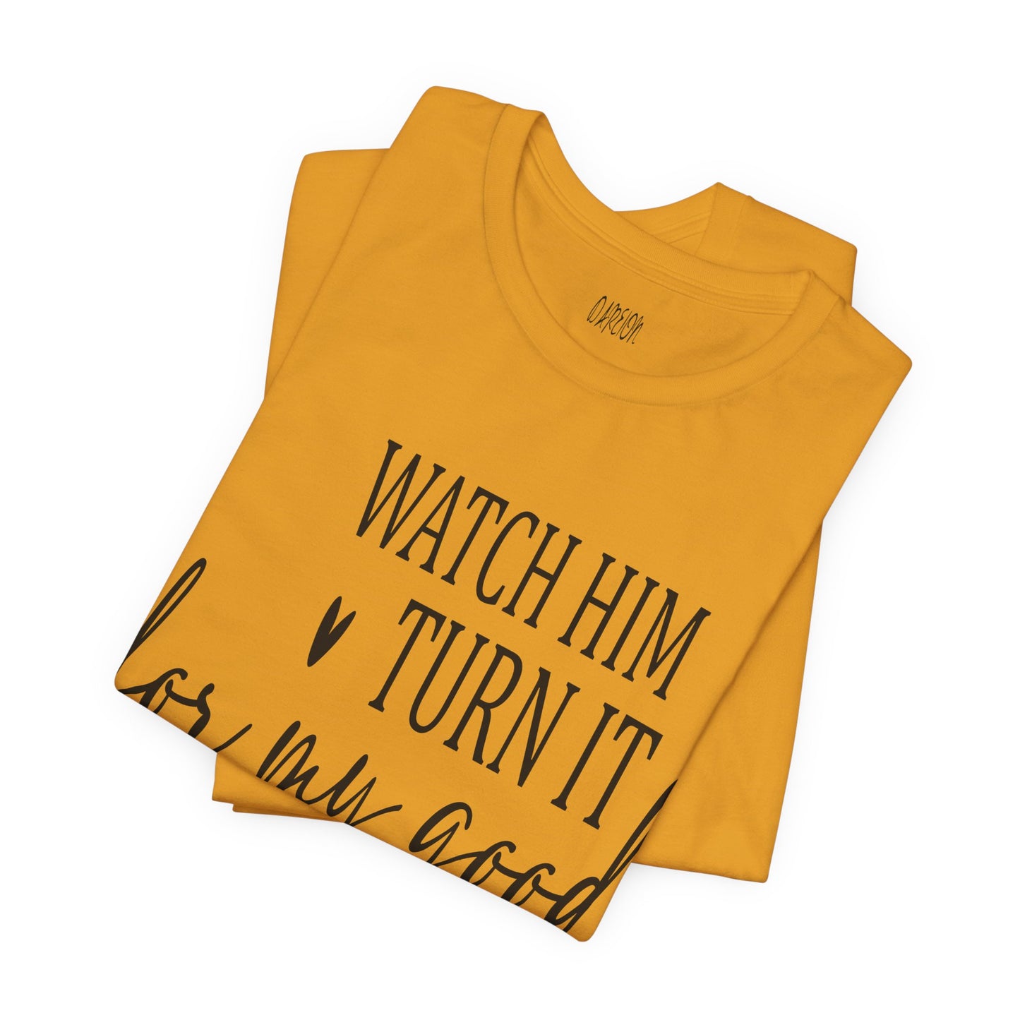 Folded mustard t-shirt with black text on a white background