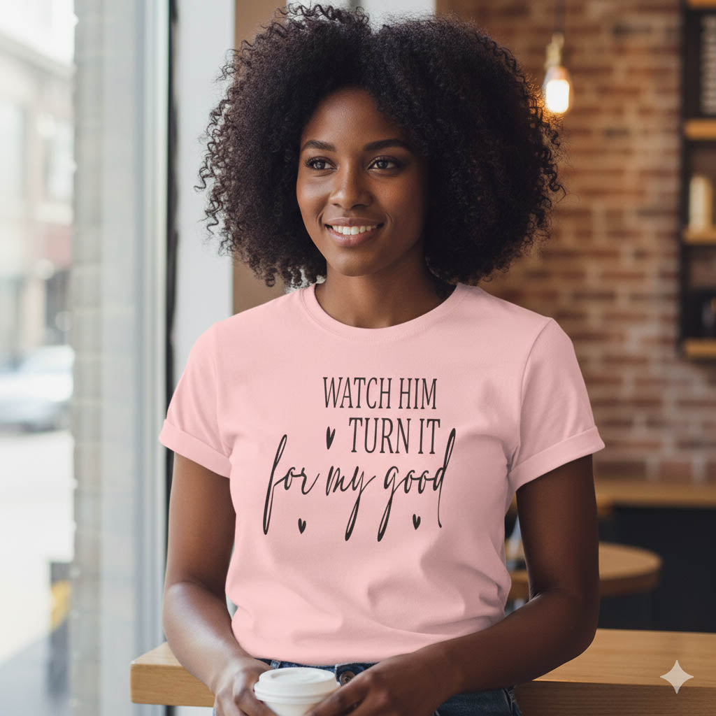Woman wearing a pink t-shirt with text in a casual setting