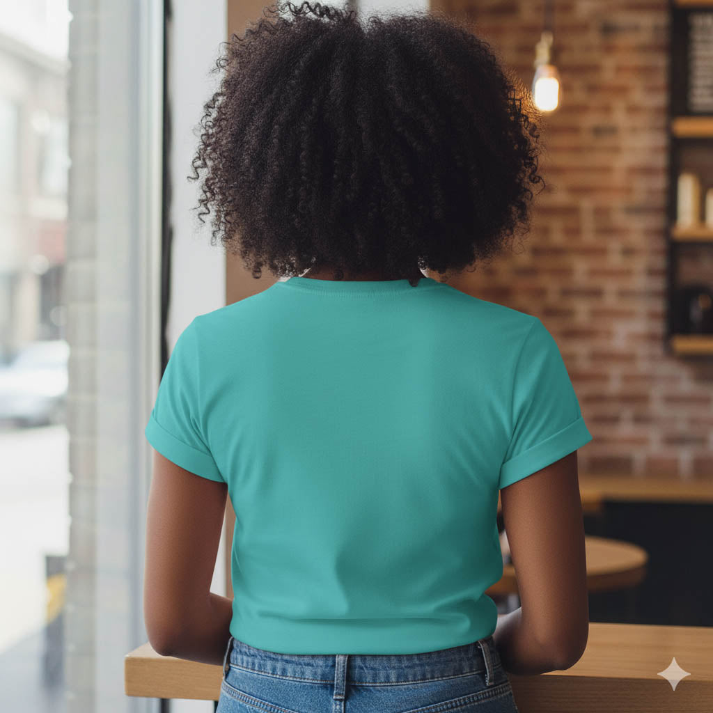Person wearing a teal shirt in a casual setting