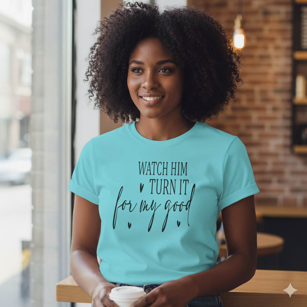 Woman wearing a turquoise t-shirt with text in a casual setting