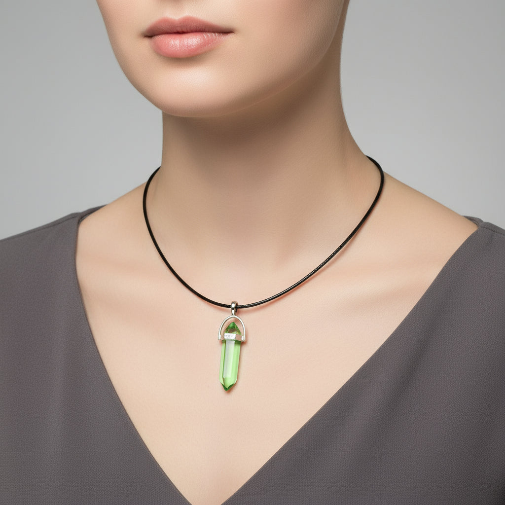 Necklace with a green crystal pendant on a model against a neutral background