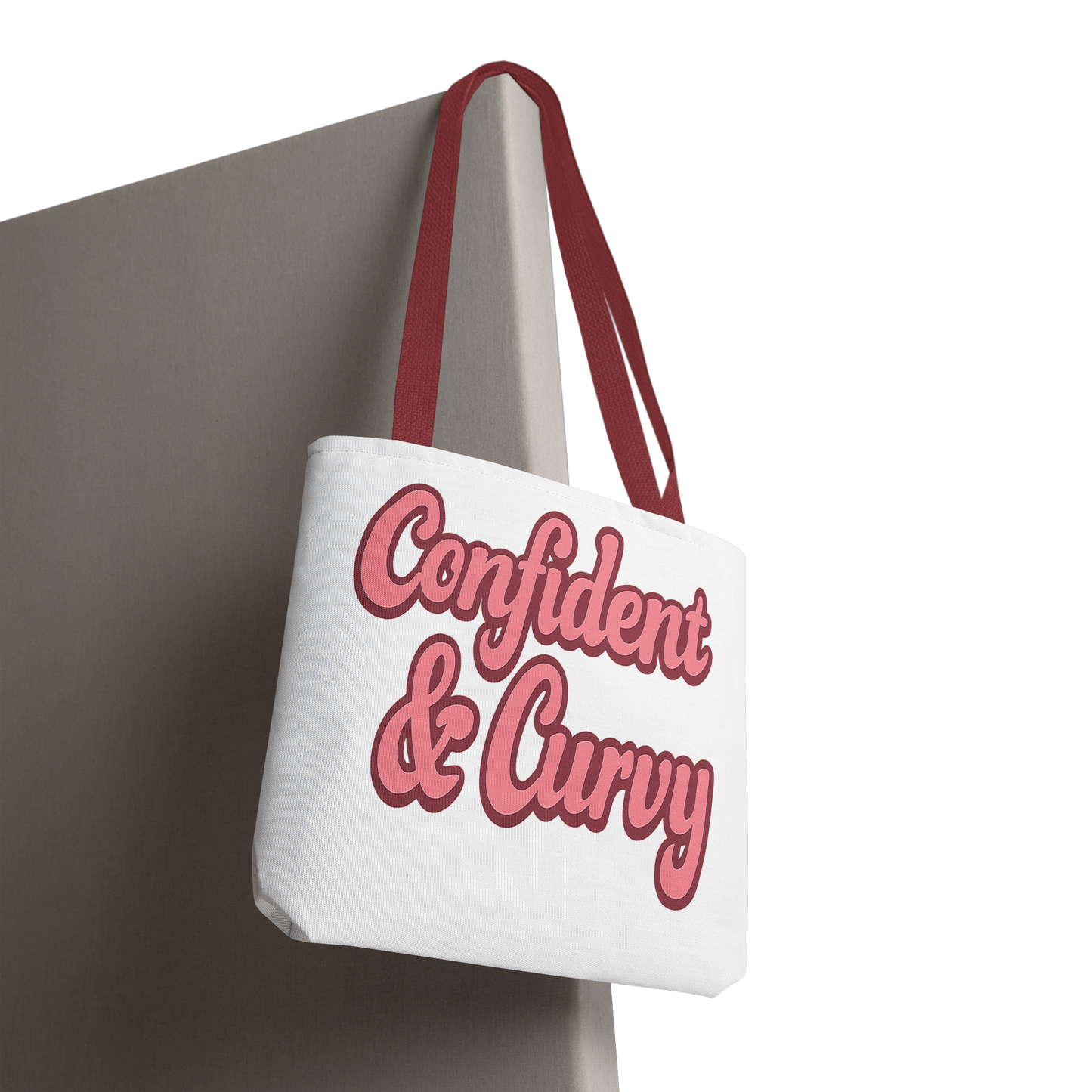 Tote bag with 'Confident & Curvy' text on a white background
