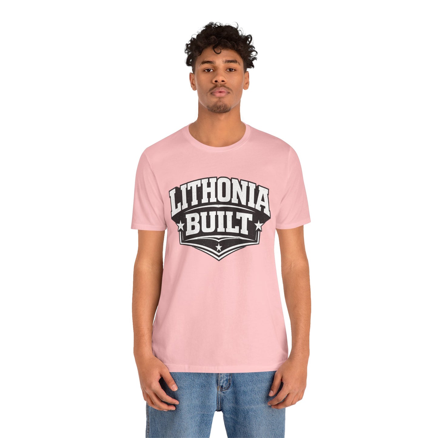 Person wearing a pink t-shirt with 'Lithonia Built' text on a white background