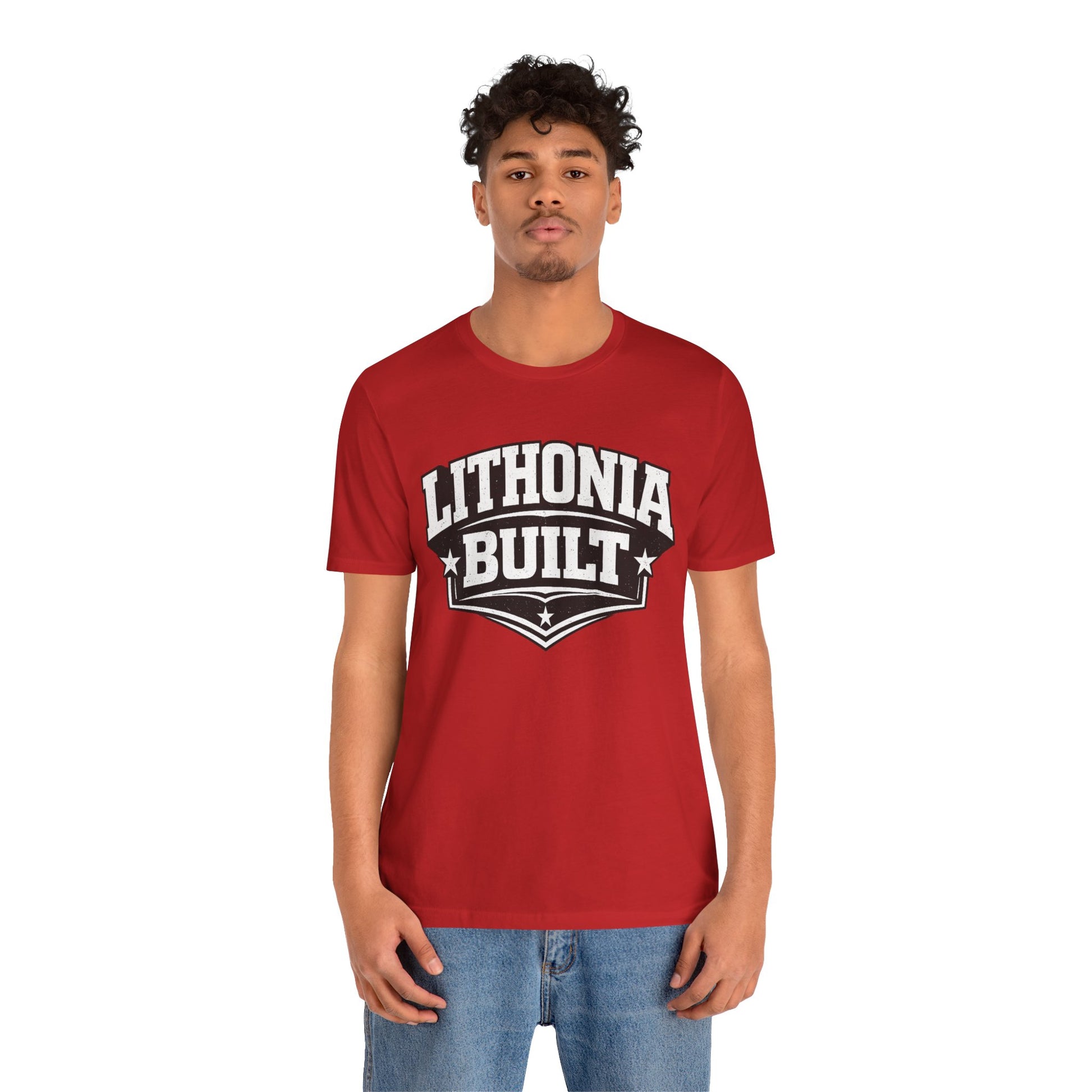 Person wearing a red 'Lithonia Built' t-shirt on a white background
