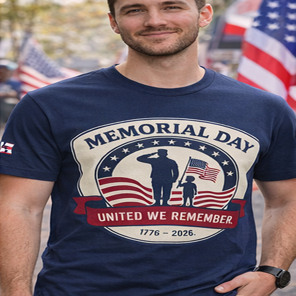 Man wearing a navy blue t-shirt with a Memorial Day design featuring a silhouette of a soldier and child holding an American flag.
