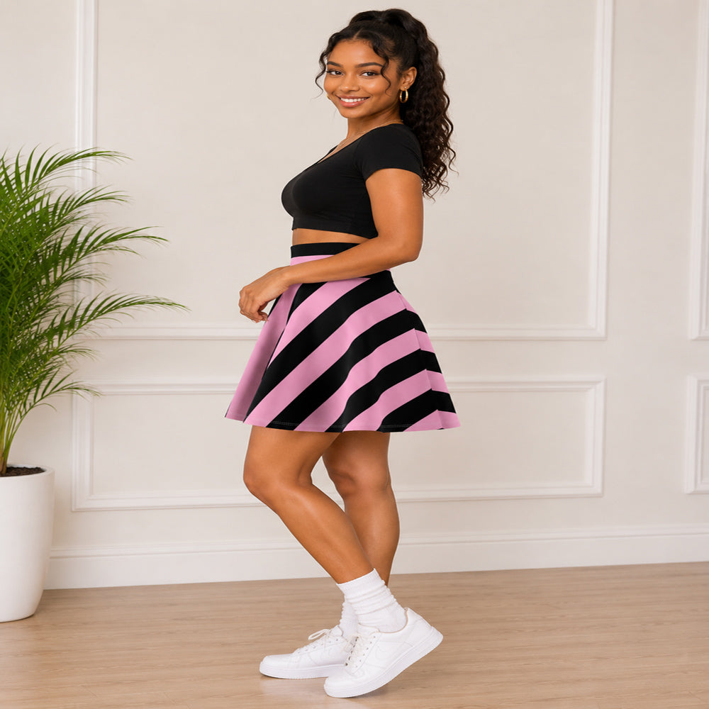 Woman wearing a black and pink striped skirt with a black crop top indoors.