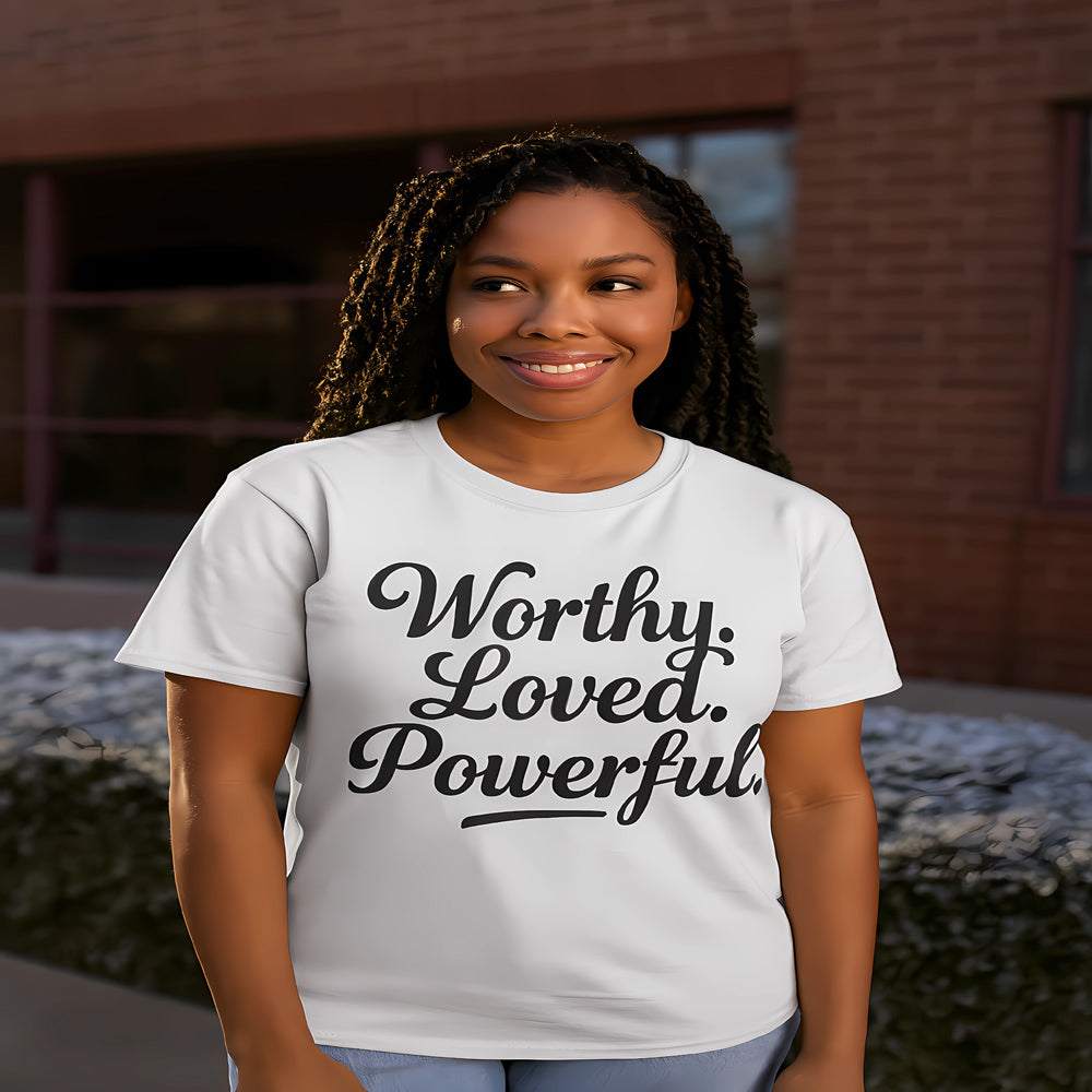 Person wearing a white t-shirt with 'Worthy. Loved. Powerful.' text.